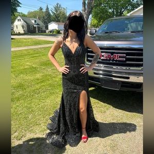 Beautiful Black Prom Gown. Has a small train, Size 2. Over $500, worn once.